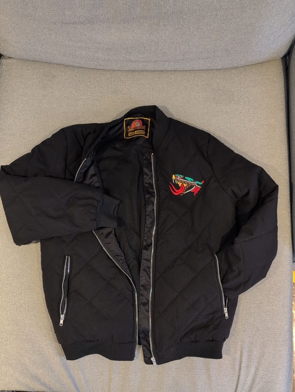 Indestructible MFG Black Quilted Bomber Jacket with Embroidered Snake Patch